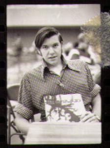 Paul Goodson with Olympiad yearbook